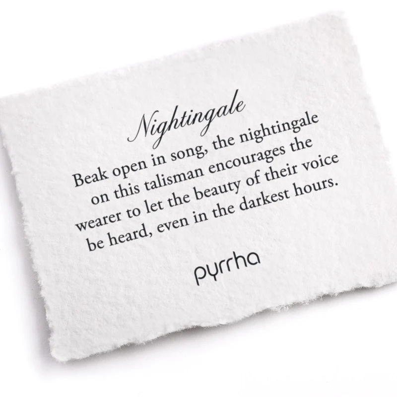 A Pyrrha Note describing the NIghtingale Talisman. It reads, "Beak open in song, the nightingale on this talisman encourages the wearer to let the beauty of their voice be heard, even in the darkest hours."