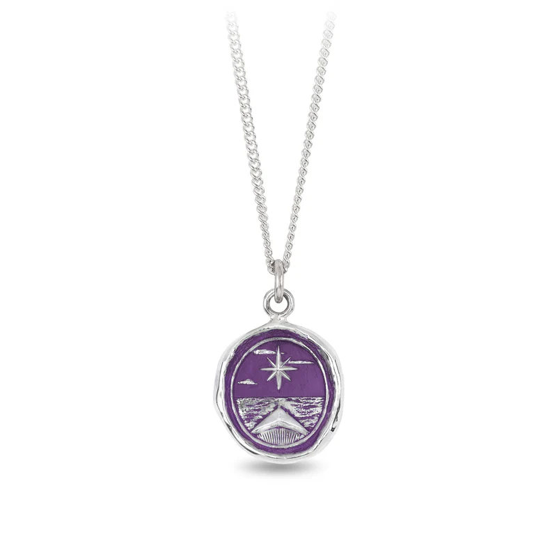 Sterling Silver necklace with a violet background under a talisman depicting The grand north star shing bright over a sea, with the bow of a boat facing it