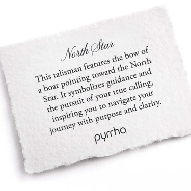A Pyrrha Note describing the North star talisman. it reads, "This talisman features the bow of a boat pointing toward the North Star. It symbolizes guidance and the pursuit of your true calling, inspiring you to navigate your journey with purpose and clarity."