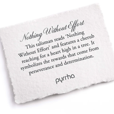 A Pyrrha note describing the Nothing Without effort talisman. It reads, "This talisman reads 'Nothing Without Effort' and features a cherub reaching for a heart high in a tree. It symbolizes the rewards that come from perseverance and determination."