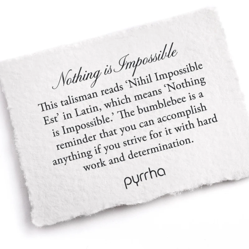 A Pyrrha note describing the Nothing is Impossible talisman. It reads, "This talisman reads 'Nihil Impossible Est' in Latin, which means 'Nothing is Impossible.' The bumblebee is a reminder that you can accomplish anything if you strive for it with hard work and determination."