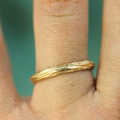 14k yellow gold hand carved tree inspired textured band | on model
