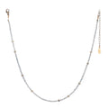Oso Necklace is a simple beaded gemstone strand with recycled brass beads asymmetrically spaced throughout.