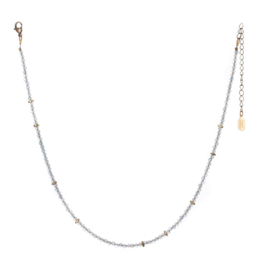 Oso Necklace is a simple beaded gemstone strand with recycled brass beads asymmetrically spaced throughout.