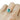 14k yellow gold ring, featuring an oval teal sapphire, 1.63ct | on model