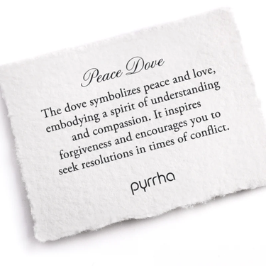 A Pyrrha note describing the peace dove talisman. It reads, "The dove symbolizes peace and love, embodying a spirit of understanding and compassion. It inspires forgiveness and encourages you to seek resolutions in times of conflict."