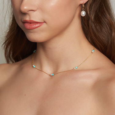 14k Yellow Gold Chain necklace with joined turquiouse beads and pearls strung along the necklace | on model