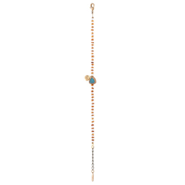 This unique bracelet features a combination of Hessonite, Moonstone, brass-edged Turquoise, and a 14K gold-plated brass coin pendant, all showcased in a striped pattern. 