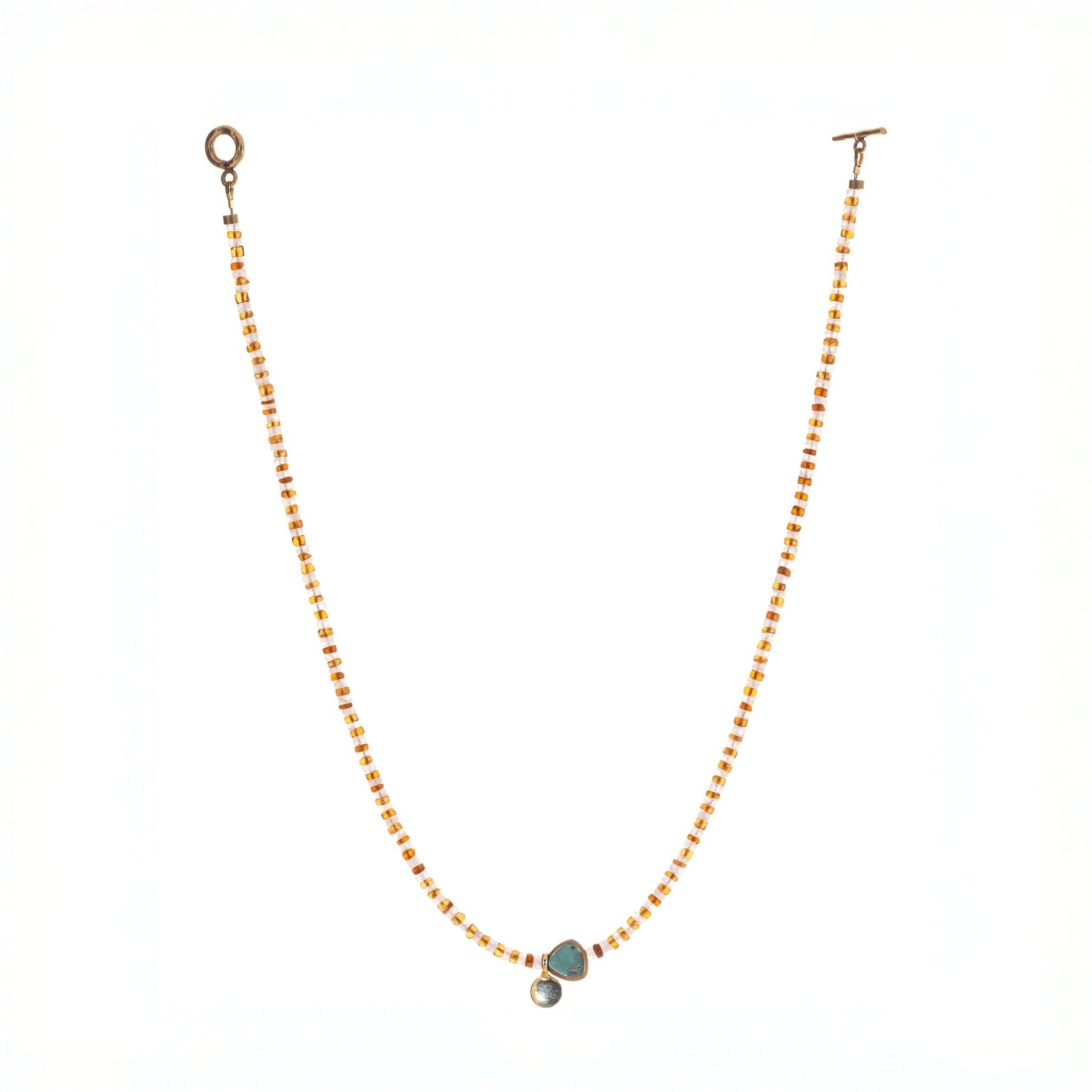  striped necklace showcasing Hessonite, Moonstone, brass-edged Turquoise triangle and 14K gold-plated brass coin pendant. 