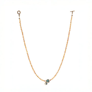  striped necklace showcasing Hessonite, Moonstone, brass-edged Turquoise triangle and 14K gold-plated brass coin pendant. 