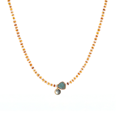  striped necklace showcasing Hessonite, Moonstone, brass-edged Turquoise triangle and 14K gold-plated brass coin pendant. 