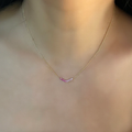 14k Yellow Gold Necklace with Pink sapphires studded at the base in the shape of a wide V | On Model