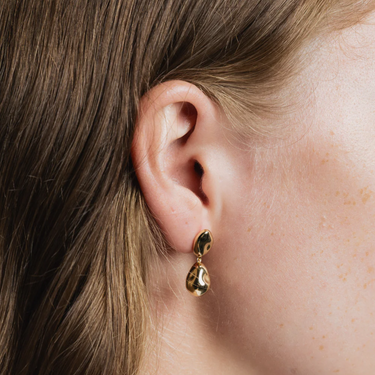 14k Gold plated Brass Bean shaped dangle statement earring with gold vermeil ear posts | on model