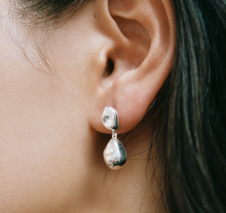 Sterling Silver Bean shaped dangle statement earring with sterling silver ear posts | on model
