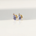 Lilac purple oval cut sapphire earrings accented by a tiny colourless round cut sapphire in solid 14k Yellow Gold. 