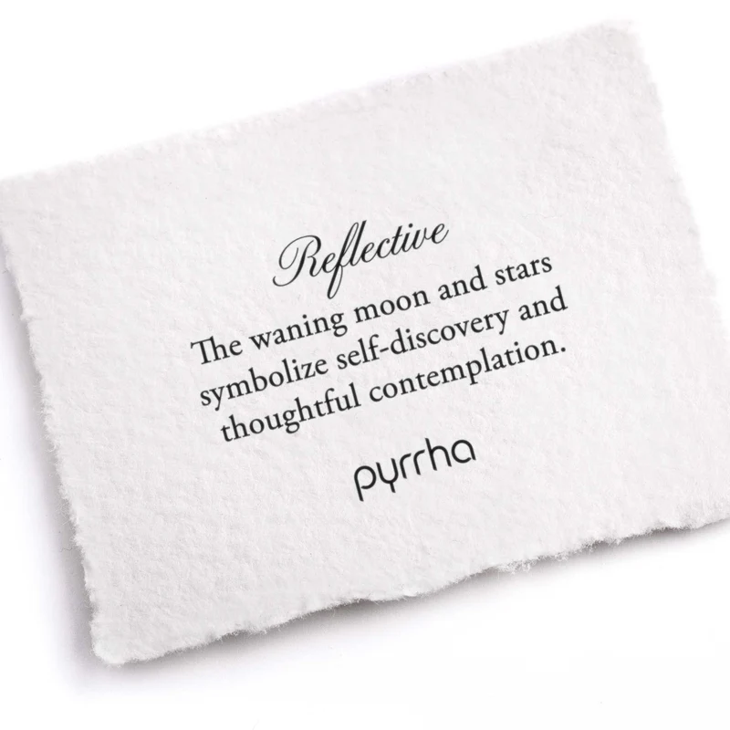A Pyrrha note describing the Reflective Talisman. It reads, "The waning moon and stars symbolize self-discovery and thoughtful contemplation."