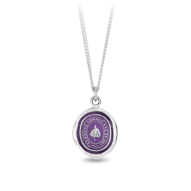 Sterling Silver Necklace with a violet background under a talisman depicting a birch leaf surrounded by the words, "Seasons Change and So Do I"