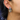 Plated Sterling Silver Earring Featuring an Intricate Design with mixes of multicoloured Textile thread and multiple sizes of gemstones and beads. The main colours include tones of blue, green and white. | on model