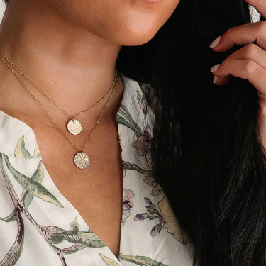 14k yellow gold fill necklace featuring a medallion pendant with a hammered texture | on model