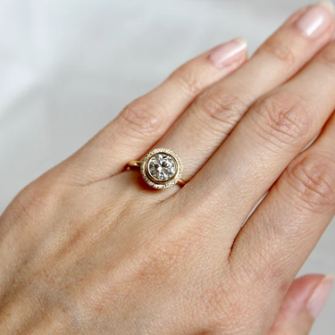 14k Yellow gold band, with aStardust Halo design, featuring a 1.00ct lab grown diamond. Hand carved and set in 14k yellow gold. | on model