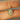 10k Yellow Gold Pendant, in the shape of a sun with a diamond sat in the center. | on model