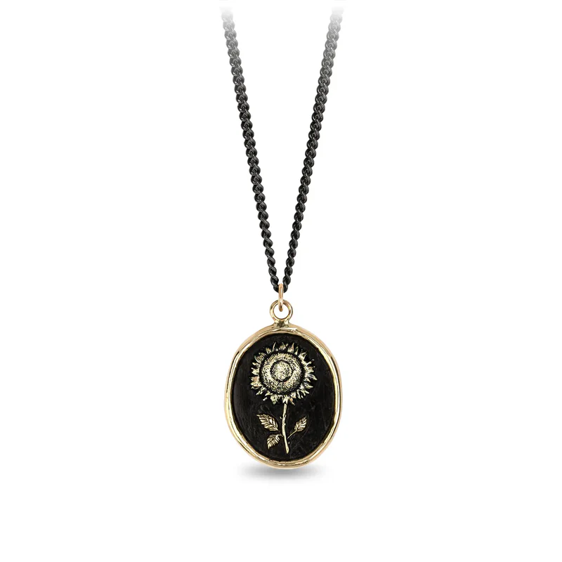 Black sterling silver necklace with a 14k gold talisman depicting a tall sunflower