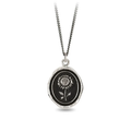A Sterling Silver Pyrrha Talisman With a black background depicting a Large Upright Sunflower