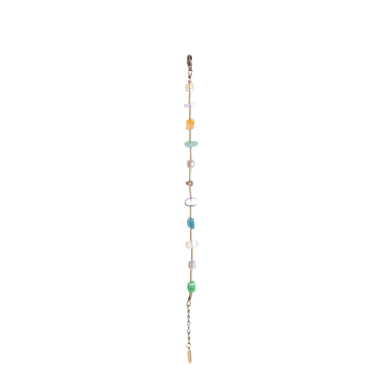 This handmade Surya Bracelet features a fun and beachy multicolour design with warm brass accents. featuring Chrysoprase, Carnelian, Apatite, Amethyst, Freshwater Pearl, and gold-plated brass nuggets.