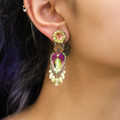 Plated Sterling Silver Earrings predominantly featuring Beige and Red purple tones, designed in a feather shape with dangling stones, surrounding a gemstone embeded within | on model