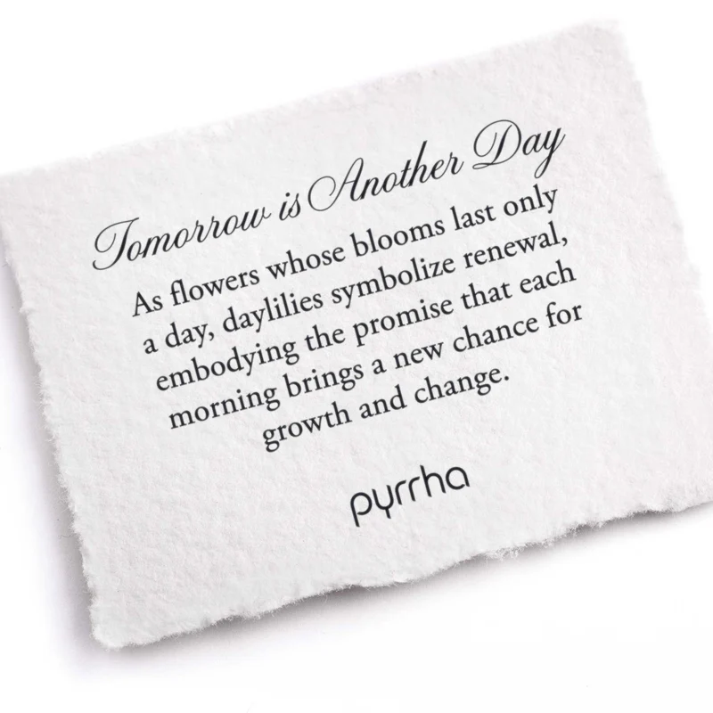 A Pyrrha note describing the Tomorrow is Another Day talisman. It reads, "As flowers whose blooms last only a day, daylilies symbolize renewal, embodying the promise that each morning brings a new chance for growth and change."