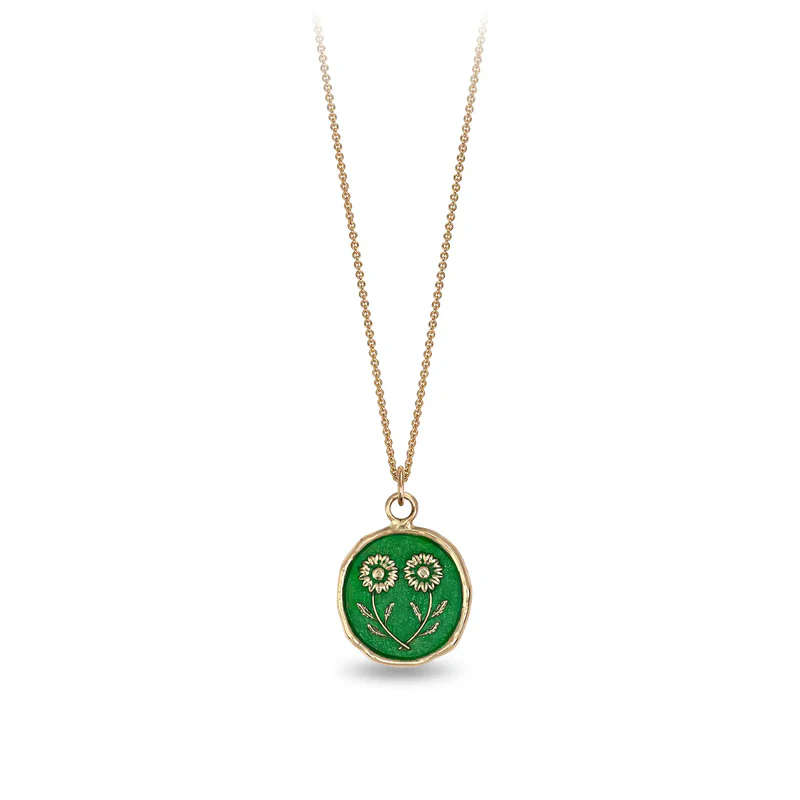 14k Yellow gold talisman necklace with a bright green background depicting 2 mirrored daises touching at their stems