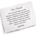 A Pyrrha note describing the True Friends talisman. It reads, "The mirrored daisies on this talisman represent two souls growing together. Symbols of mutual respect, understanding, and quiet strength—they remind us that true friends reflect, support, and bring out the best in each other."