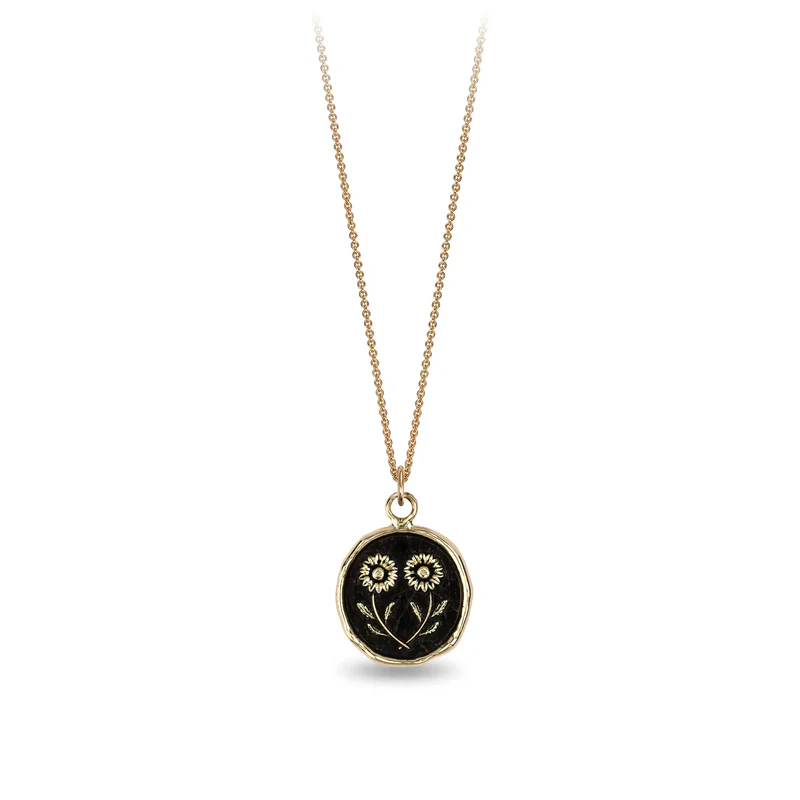 14k Yellow gold necklace with a gold talisman depicting two daisies mirroring eachother at the stem
