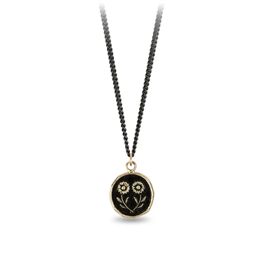Black Sterling Silver necklace with a 14k yellow gold talisman depicting two daisies mirroring eachother at the stem