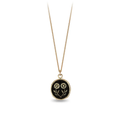14k Yellow gold necklace with a gold talisman depicting two daisies mirroring eachother at the stem