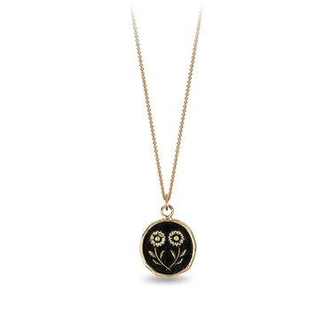 14k Yellow gold necklace with a gold talisman depicting two daisies mirroring eachother at the stem