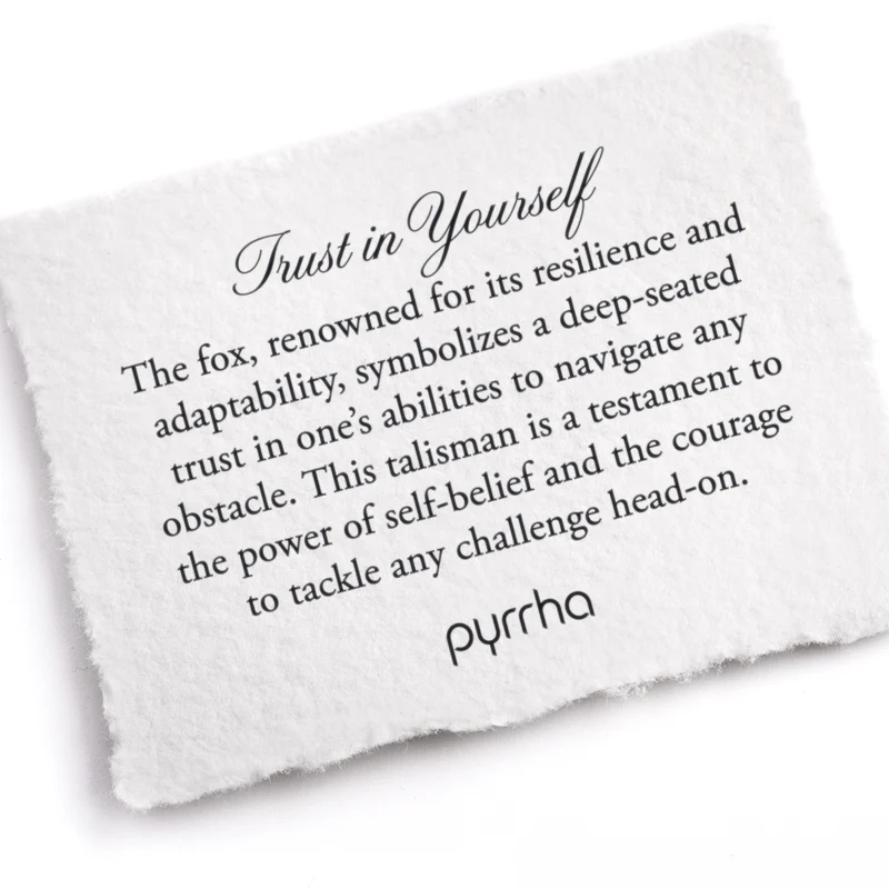 A Pyrrha note that describes the Trust in yourself talisman. It reads, "The fox, renowned for its resilience and adaptability, symbolizes a deep-seated trust in one's abilities to navigate any obstacle. This talisman is a testament to the power of self-belief and the courage to tackle any challenge head-on."