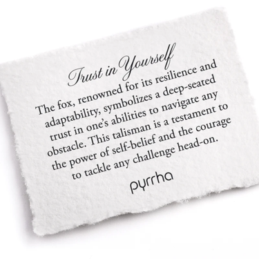 A Pyrrha note that describes the Trust in yourself talisman. It reads, "The fox, renowned for its resilience and adaptability, symbolizes a deep-seated trust in one's abilities to navigate any obstacle. This talisman is a testament to the power of self-belief and the courage to tackle any challenge head-on."