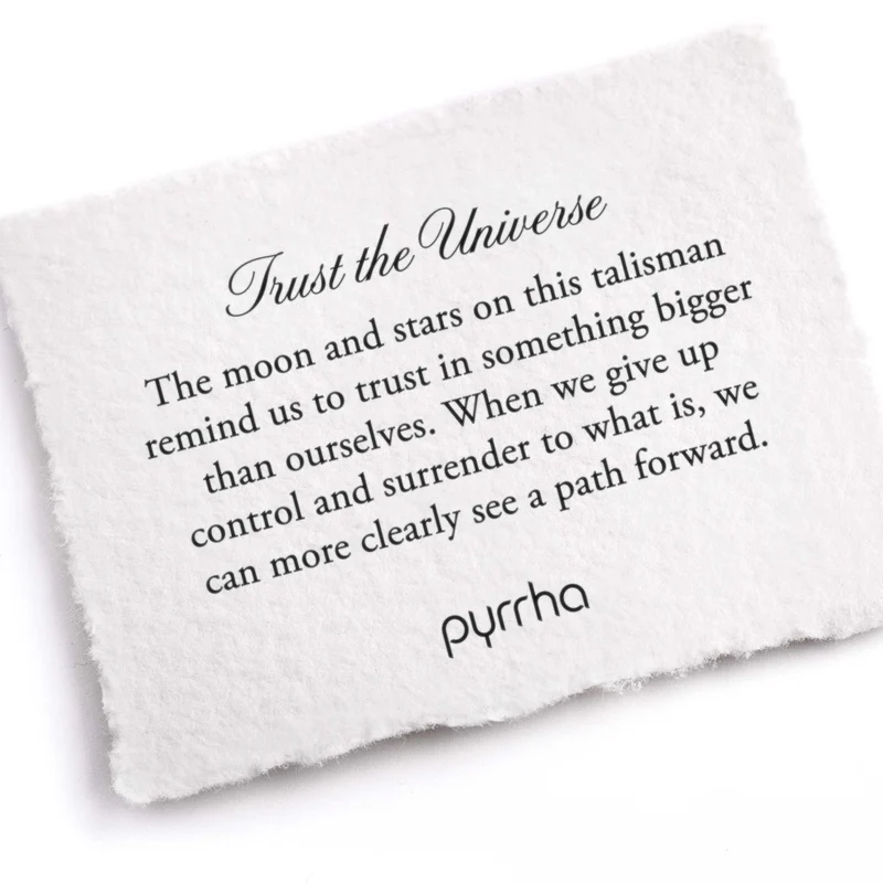 A Pyrrha Note describing the Trust the Universe talisman. It reads, "The moon and stars on this talisman remind us to trust in something bigger than ourselves. When we give up control and surrender to what is, we can more clearly see a path forward."