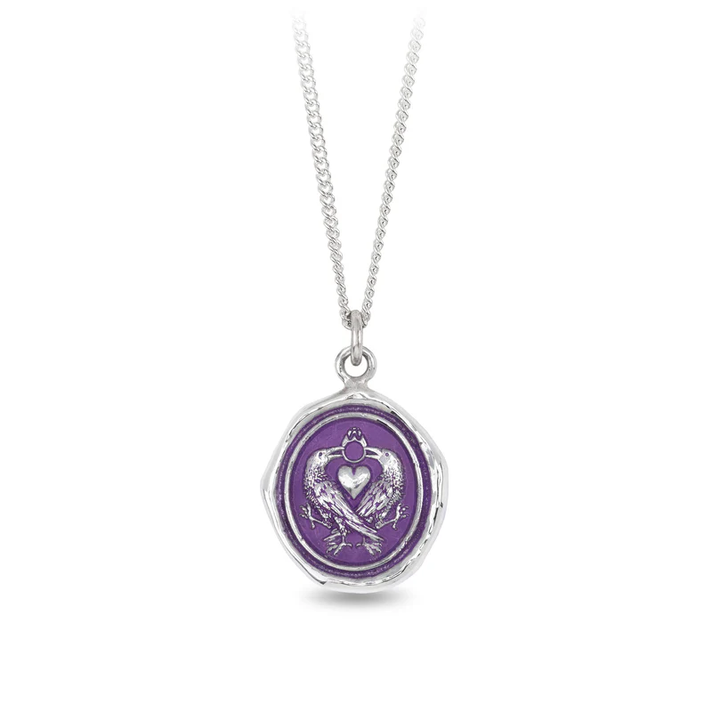 Sterling Silver necklace with a violet background under a talisman depicting two ravens side by side with a heart between them with a ring connecting at the top