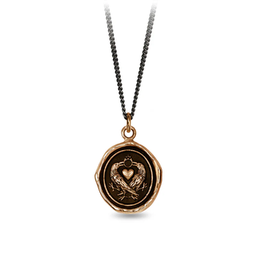 Bronze Necklace featuring a talisman depicting 2 crows crossing eachother with a heart between them and their beaks connected by a ring 
