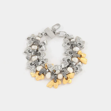 Chunky two-tone bracelet featuring threaded pearls and pewter pendants