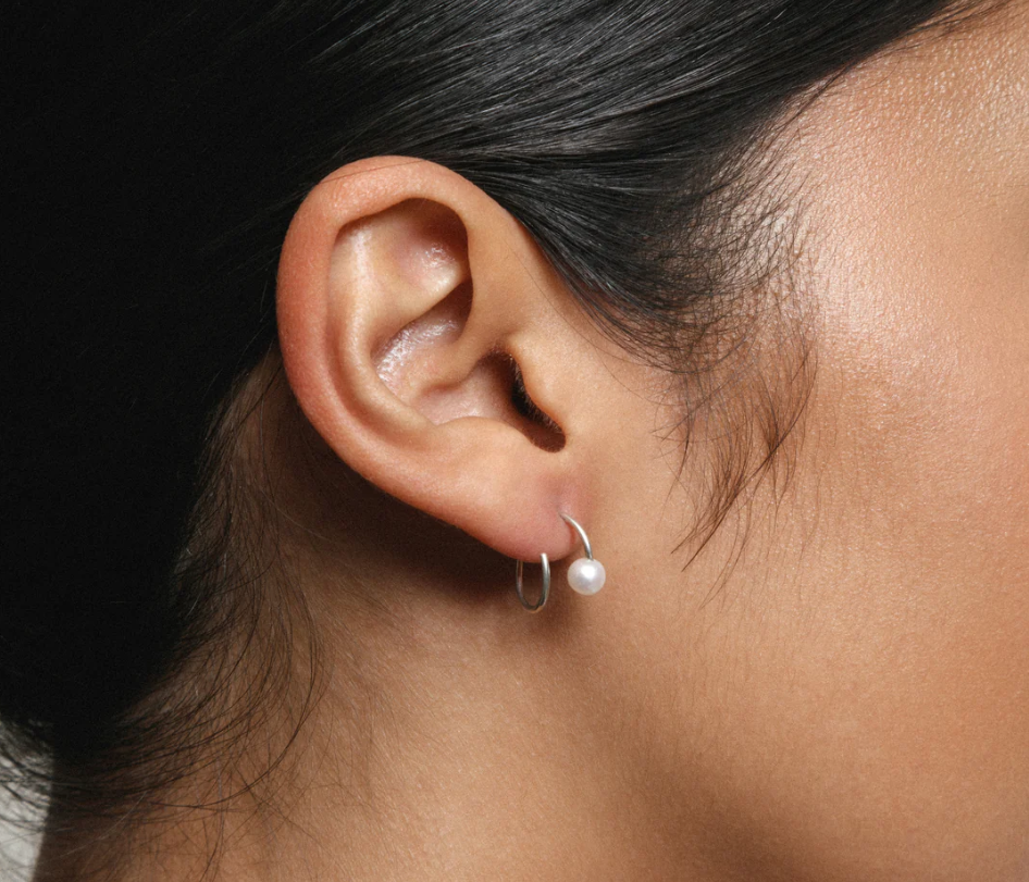 sterling silver spiral wire earrings with freshwater pearl caps | on model