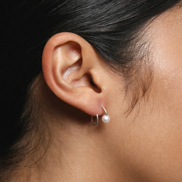 sterling silver spiral wire earrings with freshwater pearl caps | on model