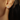 14k Yellow gold plated sterling silver studs  with a pear cut white topaz gemstone  | on model