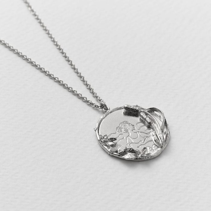 Silver Necklace with a Pendant engraved with a woman swimming in teh water, with floral accents