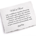 A Pyrrha note describing the Wild at Heart talisman. it reads, "Like a wildflower meadow blooming freely under open skies, this talisman symbolizes a spirit guided by instinct, emotion, and authenticity. It is a reminder to stay true to yourself and to grow untamed and beautifully wild."