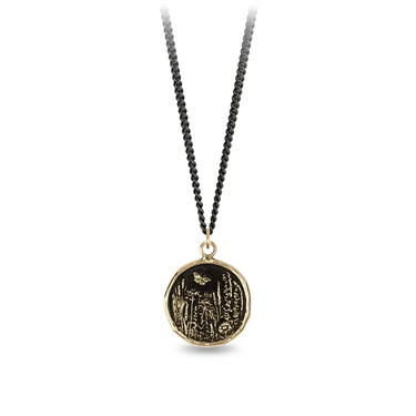 Black Sterling Silver Necklace with a 14k yellow gold talisman depicting a Butterfly flying over a field of varying flora and plants