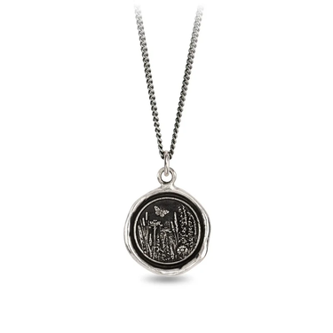 Sterling Silver Necklace with a talisman depicting a Butterfly above a large field of flowers and plants.
