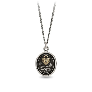 A Sterling Silver talisman necklace with a gold Plated heart lock, above a silver key surrounded by the words "You Hold the Key" on a banner
